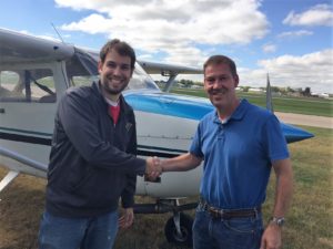 CFI Mark Jaeger congratulating his student and new private pilot Tim Silver
